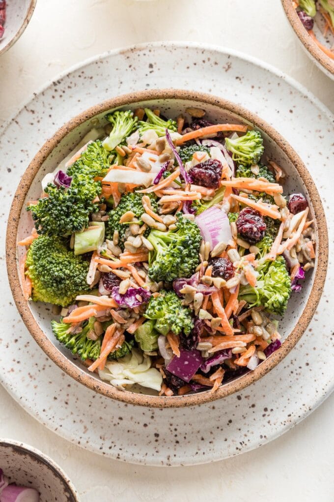 Small bowl filled with a serving of broccoli salad.