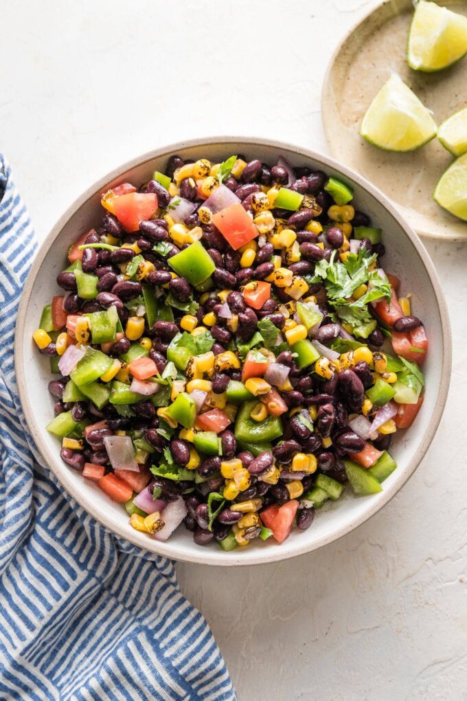 Small serving bowl full of black bean salsa.