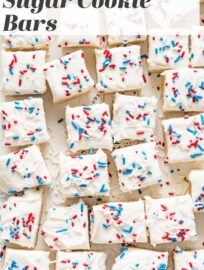 Need a festive and patriotic dessert? These 4th of July sugar cookie bars are easy to make and fun to share. They have a tender, flavorful cookie base, a generous swoop of homemade frosting, and cheerful red, white, and blue sprinkles on top. Perfect for all the summer holidays!