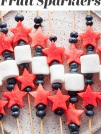 Watermelon Fruit Sparklers are fun, simple, and tasty, certain to delight kids and adults alike. They're the perfect easy snack or side for summer potlucks and BBQs, and especially fitting for Memorial Day or the Fourth of July.