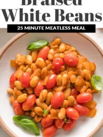 Braised White Beans with tomatoes and basil make a simple yet hearty and delicious weeknight dinner. We love to serve it in shallow bowls with garlic knots or sourdough toast and extra fresh herbs.