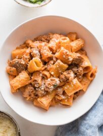 Small pasta bowl filled with a serving of ground beef pasta.