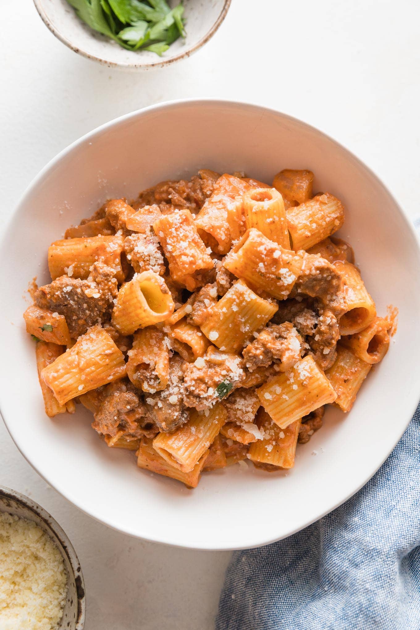 Small pasta bowl filled with a serving of ground beef pasta.