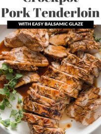 Pork tenderloin cooked with a balsamic glaze, sliced into medallions, and presented on a platter with a garnish of fresh oregano.