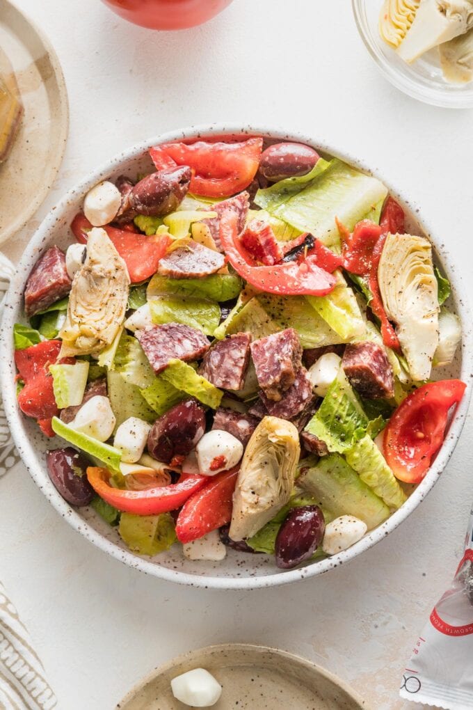 Small bowl with a helping of Italian antipasto salad.
