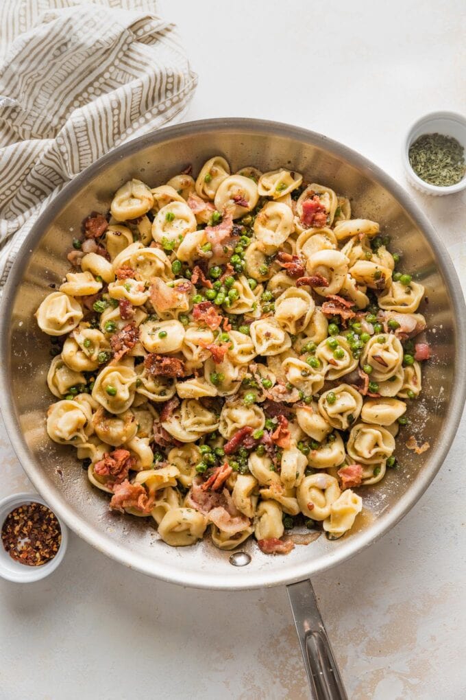 Tortellini, crisped bacon, and browned butter all tossed together in a skillet.