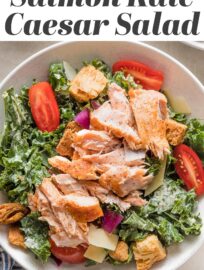 This Salmon Kale Caesar Salad is packed with tangy Parmesan, juicy tomatoes, tart red onions, crunchy croutons, and tender baked salmon for a delicious twist on a classic. We love this for a flavorful, feel-good lunch or light dinner.