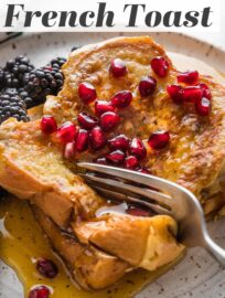 Eggnog French Toast is the perfect holiday breakfast -- delicious and festive, yet made with simple pantry ingredients plus buttery challah and creamy eggnog! Bonus: it's quick and easy enough to make on Christmas morning.