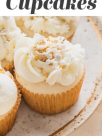 These super easy Champagne Cupcakes are made with a doctored cake mix, then filled and topped with champagne-infused buttercream. Grab this recipe when you need a treat that is super quick yet totally delicious and festive for New Year's, engagements, promotions, or any other big celebration!