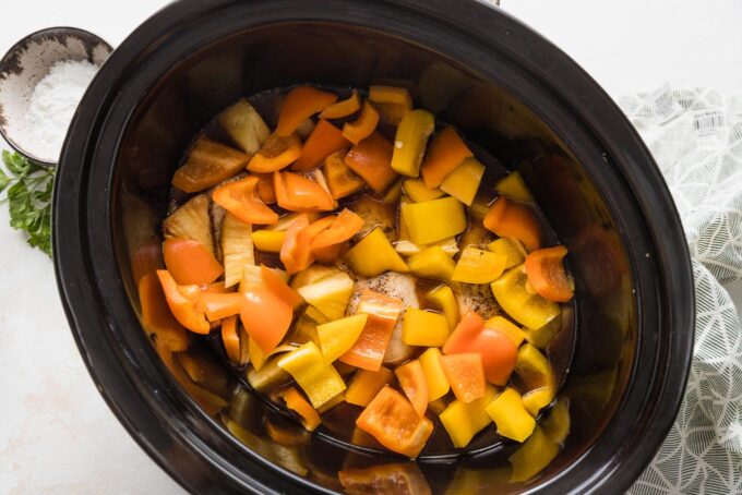 Bell peppers added to Crockpot pineapple chicken.