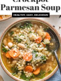 This Slow Cooker White Bean Soup with Parmesan and pearl couscous is cozy, comforting, and so easy to make. It's got tender veggies, creamy beans, and a rich rosemary and pesto-infused broth. Best of all, it's simple to toss in the Crockpot in the morning and enjoy with your family that night.