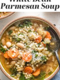 This Slow Cooker White Bean Soup with Parmesan and pearl couscous is cozy, comforting, and so easy to make. It's got tender veggies, creamy beans, and a rich rosemary and pesto-infused broth. Best of all, it's simple to toss in the Crockpot in the morning and enjoy with your family that night.