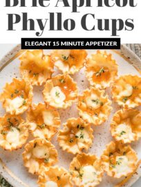 Apricot Brie Bites are beautiful and so delicious! Crisp mini phyllo cups filled with creamy baked brie and sweet apricot jam are an easy yet elegant appetizer that you can toss together in less than 15 minutes.