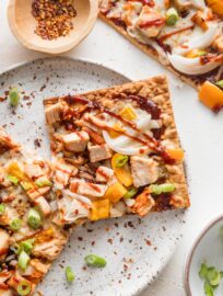 Lavash style flatbread topped with BBQ sauce, diced chicken, and veggies.
