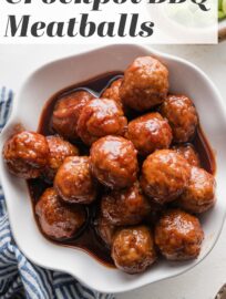 Crockpot BBQ Meatballs use just 3 ingredients and less than 5 minutes prep, yet are the ultimate party appetizer or ultra-easy dinner served over egg noodles or mashed potatoes. A few short hours in the slow cooker delivers tender, juicy meatballs coated in a sticky, sweet BBQ glaze.