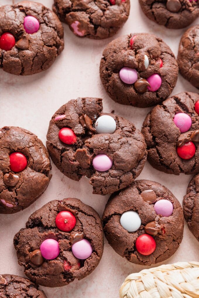 Close up of a double chocolate Valentines cookie broken in half to show the fudgy interior.