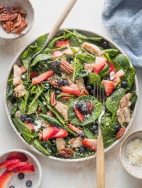 Delicious and vibrant, this Chicken Spinach Salad is dressed up with berries, pecans, and a sprinkle of feta, then wrapped up with an ultra-simple balsamic vinaigrette. Refreshing and satisfying!