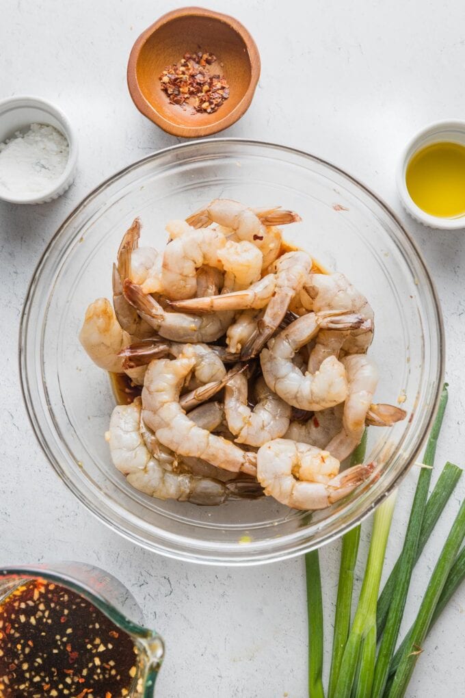 Shrimp marinating in a honey garlic soy sauce.