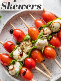 A modern classic, Caprese Skewers are the easiest and most delicious summer appetizer. They've got creamy mozzarella, juicy tomatoes, and a tangy balsamic glaze, all in a perfectly handheld package that is light, fresh, and bursting with flavor.