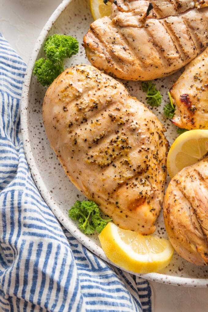Close up of a grilled lemon pepper chicken breast.