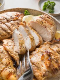 Simple and delicious, this Grilled Lemon Pepper Chicken is a perfect breezy, go-with-anything meal. The marinade of olive oil, honey, and lots of lemon and pepper sets the stage for juicy chicken breasts with a light yet enticing flavor. Pair this chicken with virtually any side you crave for dinner, then repurpose into salads and wraps for lunch throughout the week.