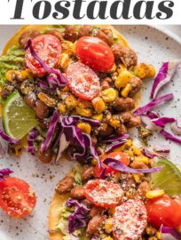 Pinto Bean Tostadas with the most delicious and vibrant street corn tomato salsa are one of my new favorite meatless meals and extra fun for entertaining! With creamy avocado, tender pinto beans, and a colorful salsa all layered on crisp, lightly salted homemade tostadas, these are an irresistible explosion of flavor and texture.