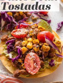 Pinto Bean Tostadas with the most delicious and vibrant street corn tomato salsa are one of my new favorite meatless meals and extra fun for entertaining! With creamy avocado, tender pinto beans, and a colorful salsa all layered on crisp, lightly salted homemade tostadas, these are an irresistible explosion of flavor and texture.
