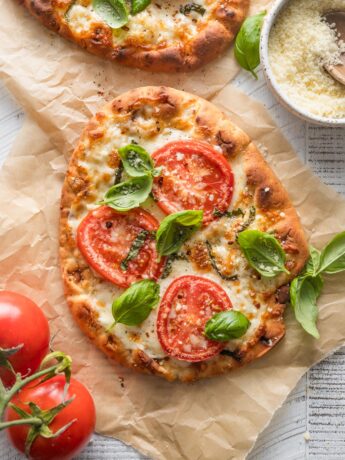Caprese flatbread with fresh tomatoes and basil made on garlic naan.