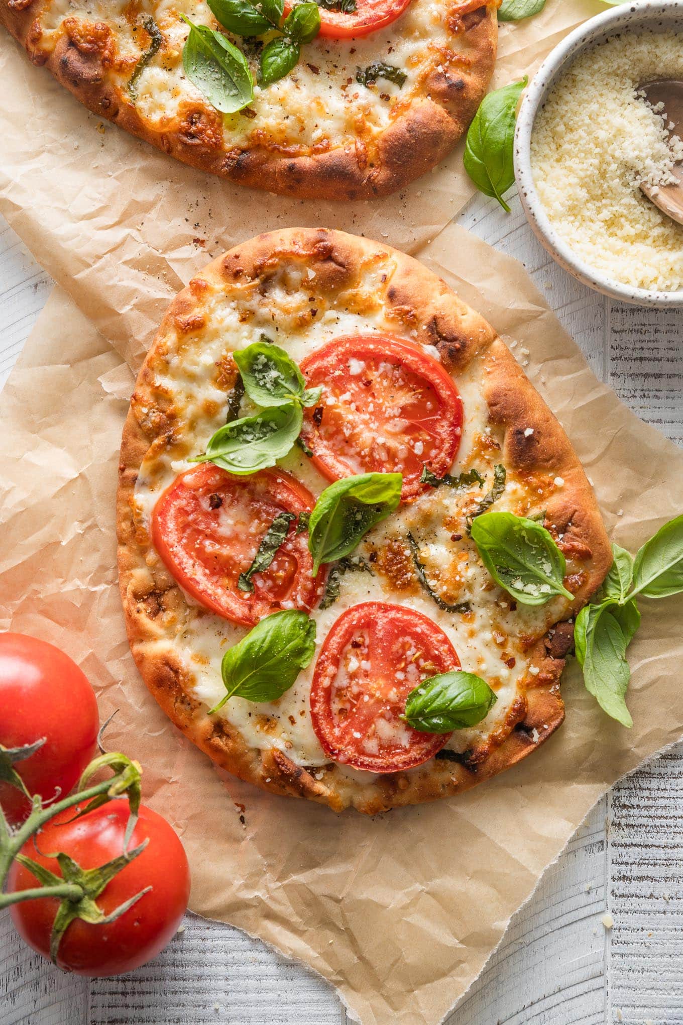 Caprese flatbread with fresh tomatoes and basil made on garlic naan.