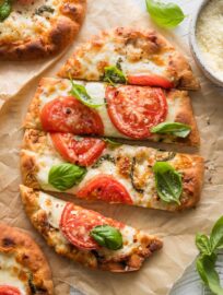 These Caprese Flatbreads are lightning fast yet extremely delicious, just the thing for an ultra-simple lunch or dinner. Use a flavorful crust, layer on the creamy mozzarella and juicy tomatoes, and go wild with the fresh basil on top--you can't go wrong!