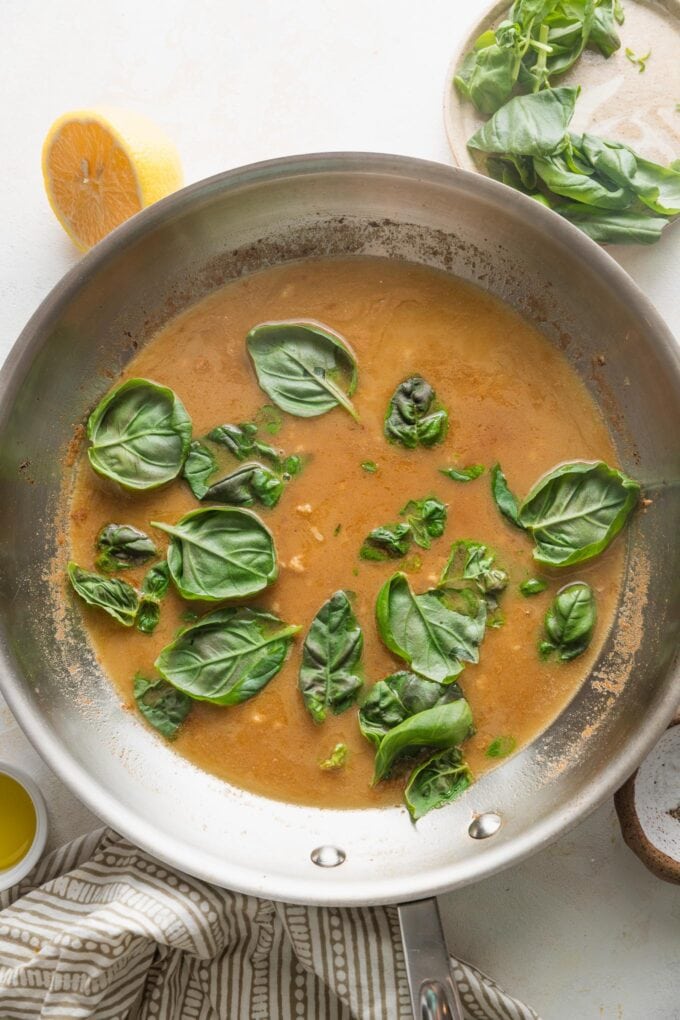 Skillet full of a basil-infused brown butter sauce.