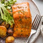 Plate with a fillet of brown sugar glazed salmon.