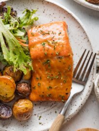 Plate with a fillet of brown sugar glazed salmon.