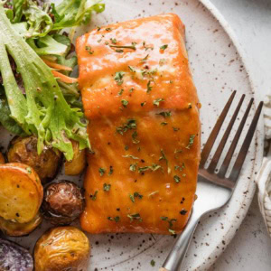 Plate with a fillet of brown sugar glazed salmon.