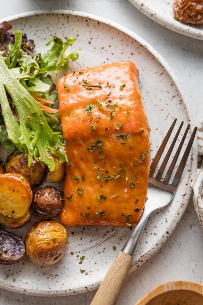 Plate with a fillet of brown sugar glazed salmon.