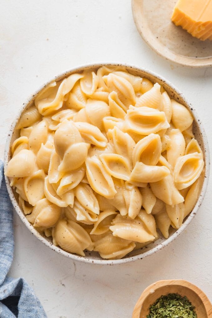 Super creamy, cheesy mac and cheese made in a pressure cooker and transferred to a small serving bowl.