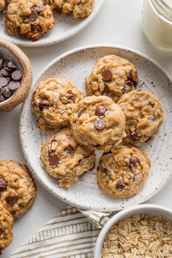 Small plate full of mini oatmeal chocolate chip cookies.