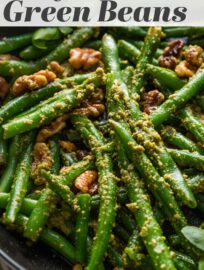Vibrant and flavorful, Pesto Green Beans are the ultimate side dish: a little elegant, still easy to make, and utterly delicious. Herbaceous pesto, a little lemon zest, and earthy toasted walnuts are the best way to take simple green beans up a notch.