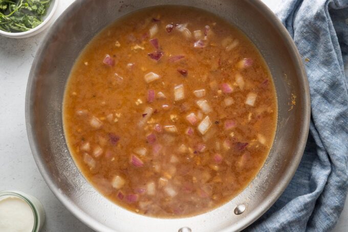 Pan sauce made with the fond of seared chicken breasts, red onion, garlic, broth, and lime juice.