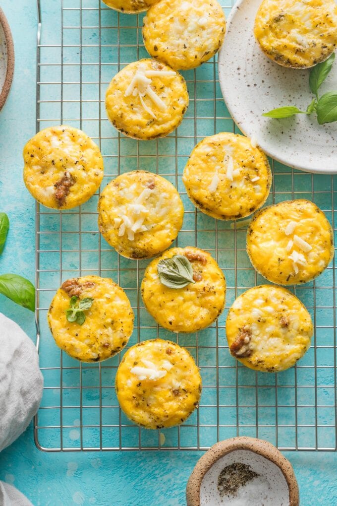 Sausage cheddar egg bites cooling on a wire rack.