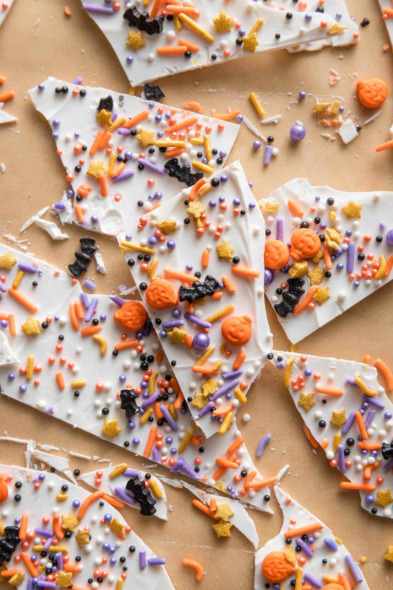 Close up of "boo bark" - a thin layer of white chocolate with Halloween-themed sprinkles stuck on top.