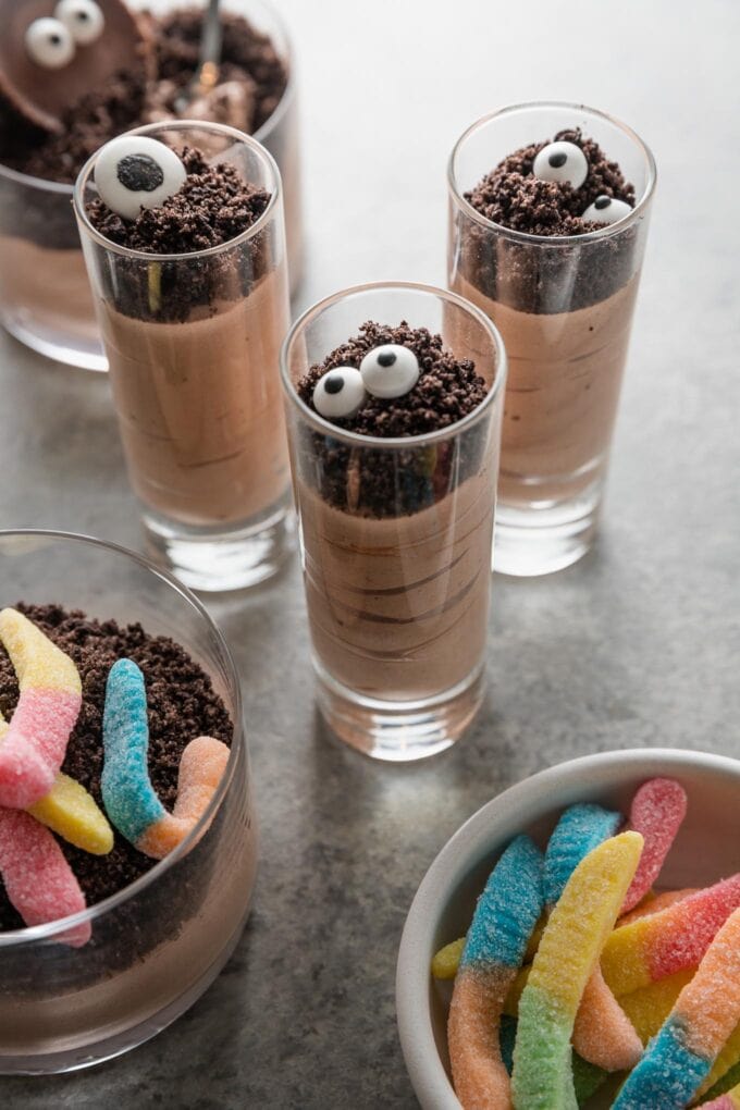 Cute, quick, and tasty, Halloween Dirt Cup Shooters are a fun spin on a classic easy dessert. Whip up the creamy chocolate pudding then have fun with the toppings; they can be as simple or as involved as you want them to be.