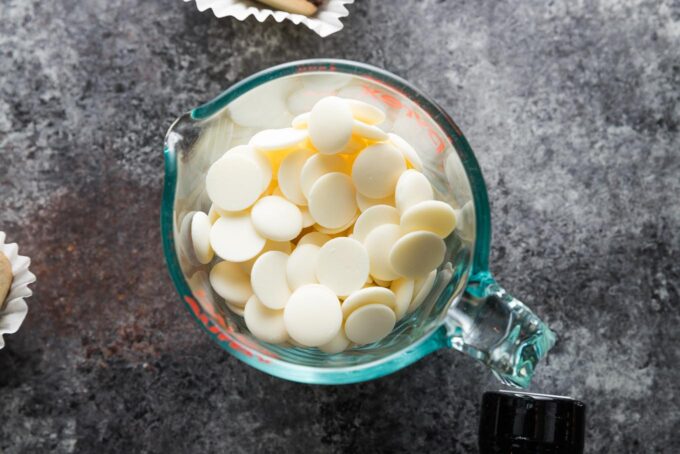 White chocolate melts in a large liquid measuring cup, ready to be melted in the microwave.