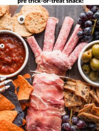 Make a slightly spooky Halloween-inspired cheese board for a pre-trick-or-treat snack everyone can enjoy. If you buy a few strategic items you can throw this together in no time and get some substance in everyone's belly before the sugar rush hits.