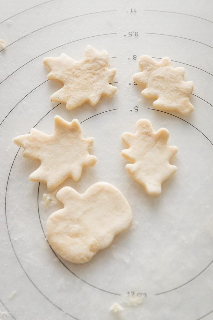Miniature pie crust leaves, cut out and ready to be treated with an egg washed and baked.