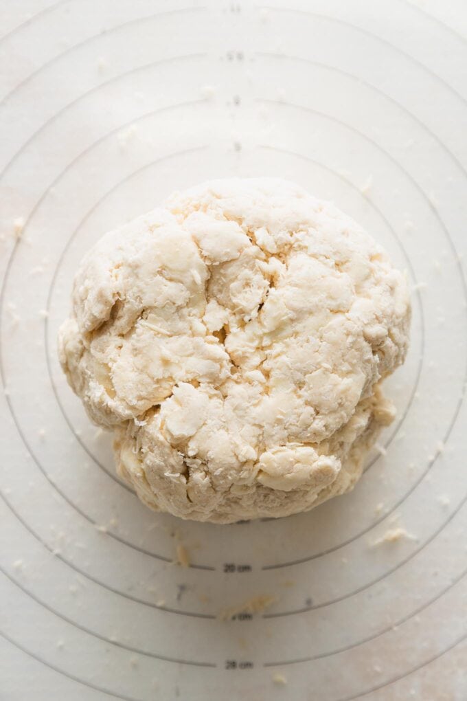 Close up of a disc of apple cider vinegar pie crust dough.