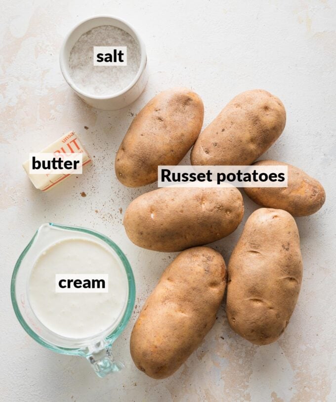 Labeled overhead photo of Russet potatoes, cream, butter, and salt.