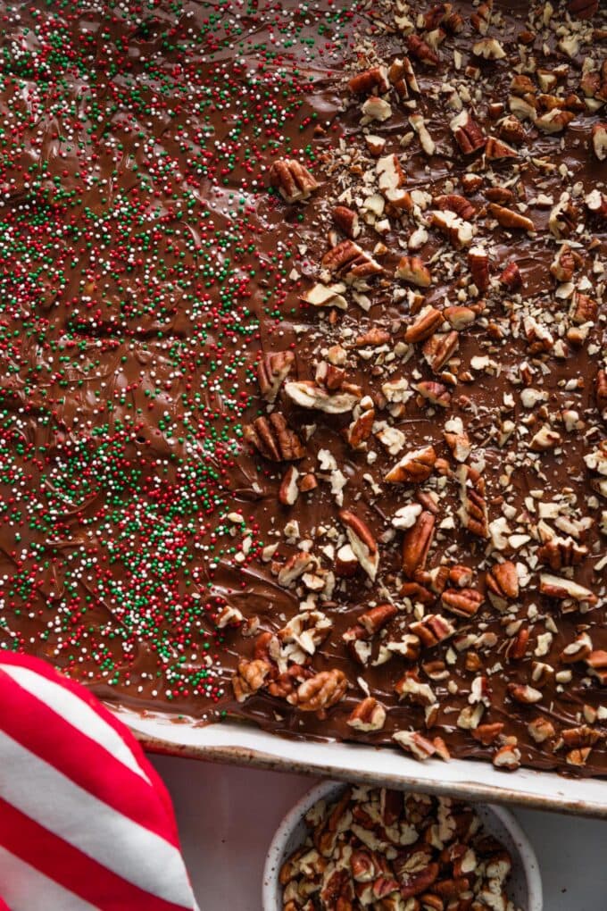 Close up of toppings scattered over Christmas cracker candy.
