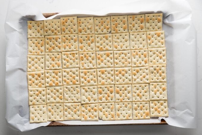 Large sheet pan filled with Saltines.