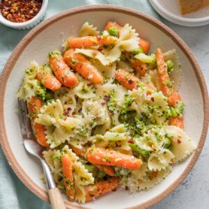 Bowl of broccoli carrot pasta with lemon and Parmesan.